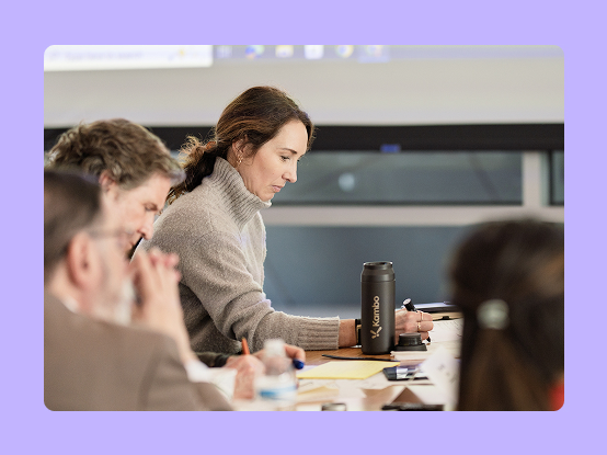 Woman working alongside peers